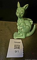 Front view of sea-foam green ceramic kangaroo planter