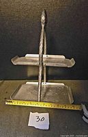 Front view of two-tier tray showing handle and tiers