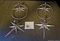 All four pieces: two towel rings and two toilet roll brackets displayed on surface