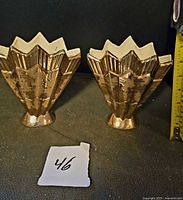 Front view of both vases showing gold glaze and shape