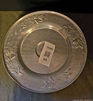 Top view showing embossed leaves and berries design