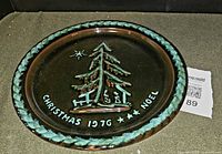 Top view showing raised Christmas 1976 design and rim detail
