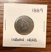 Obverse of 1889 Indian Head cent in 2x2 cardboard flip