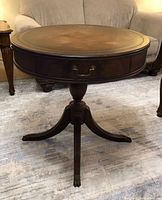 Full view of mahogany leather-top drum table