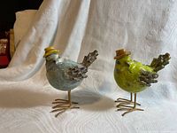 Both bird figurines side by side