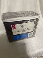 Front view of sealed Mainstays 2 Pack Sheet Set package showing label and contents
