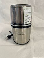 Front view of Cuisinart stainless steel spice and nut grinder with power cord visible