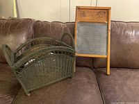 Both items together: Globe No. 40 washboard and olive green wicker magazine rack