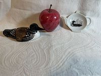 Marble apple, wooden loon carving, ceramic loon rest grouped