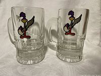Two clear glass Road Runner mugs front view