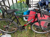 Full view of Supercycle SC1800 mountain bike leaning against other items