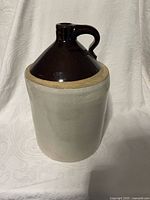 Front view showing entire brown upper and beige lower jug