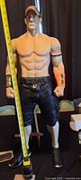 Full front view of 34" John Cena figure with measuring tape