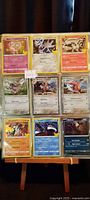 Full pocket page with 9 sleeved foil Pokémon cards