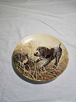 Front of plate with puppy and kitten artwork