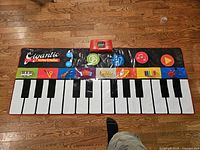 Full view of colourful roll-up floor piano keyboard playmat