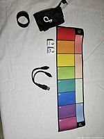 All items: two rings, colour pad, charging cable, pouch, sleeve