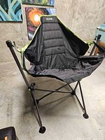 Front view of foldable Uline swing chair showing suspended seat and frame