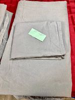 Folded grey duvet cover with pillowcase on top
