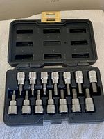 Open case showing all 14 sockets seated