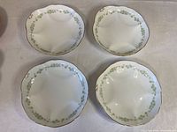 Top view of four matching Cauldon oyster plates