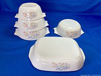 Front view showing all five Pyrex England floral dishes
