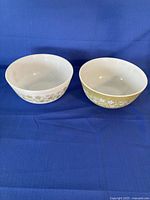 Two Pyrex Spring Blossom mixing bowls side by side