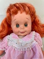 Head and torso close-up showing hair, eyes, freckles, dress detail
