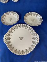 Front view of platter and two dishes displaying pattern