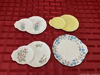 Overview of all four Royal Albert snack plates showing different patterns and integral cup recesses