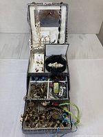 Overall view of open jewelry box with contents visible