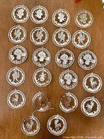 All 22 silver-tone metal ornaments displayed