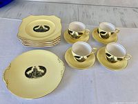 Full set: 7 plates, cake platter, 4 cups, 4 saucers