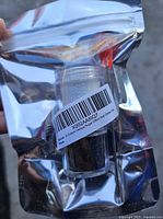 Front view of sealed foil pouch showing barcode label and contents inside