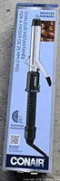 Front of sealed Conair Instant Heat curling iron retail box