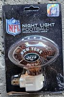 Front of packaged New York Jets football night light