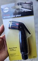 Front view of sealed Danco kitchen sink sprayer in retail packaging