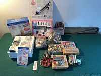 All items arranged: cookie presses, decorator kits, cutters, liners