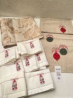 All items laid out: both runners and seven napkins visible