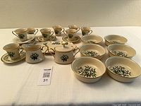 Angled view of full Lenox Holiday lot with mugs, bowls, sugar, creamer and tray