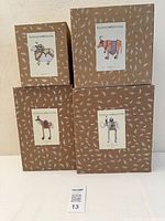 Four Patience Brewster branded boxes for Cow, Sheep, Elephant, Horse