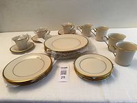 Full set of Lenox Eternal dinnerware showing plates, cups, saucers, mugs