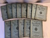 All thirteen volumes laid out showing front covers and titles