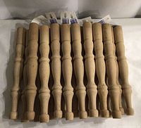 Top view of 12 hemlock legs showing turned profiles and square blocks