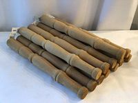 Stack of 13 hemlock furniture legs showing length and turned design