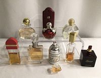 Front view of all perfume bottles on stand
