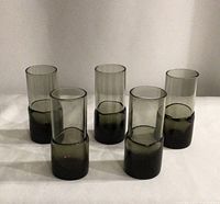 five smokey shot glasses front view