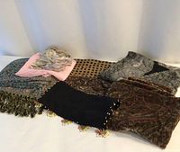 Group shot of all seven scarves laid out