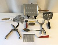 All ten utensils laid out for full lot view