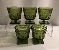Five green Park Lane sherbet glasses on display stand